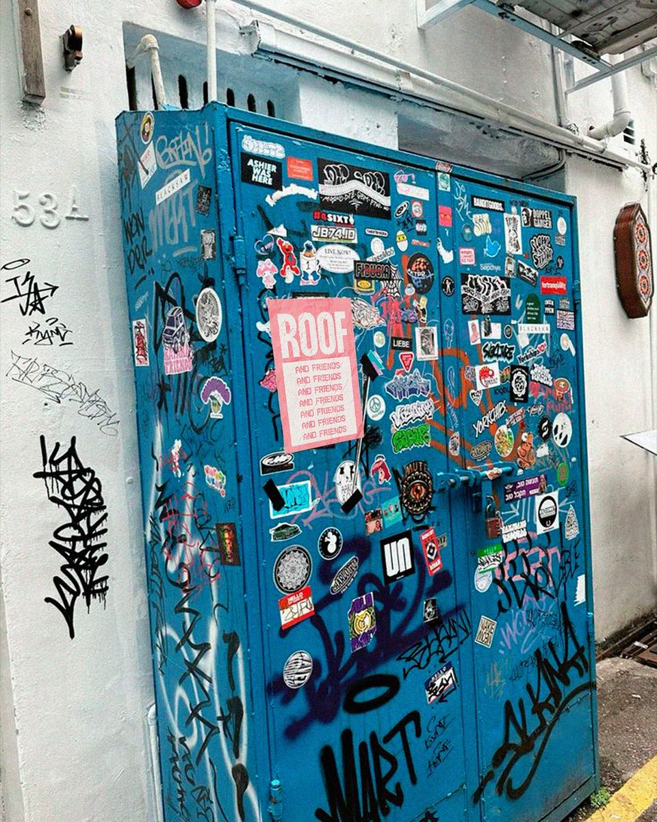 Blue cabinet covered in ROOF stickers