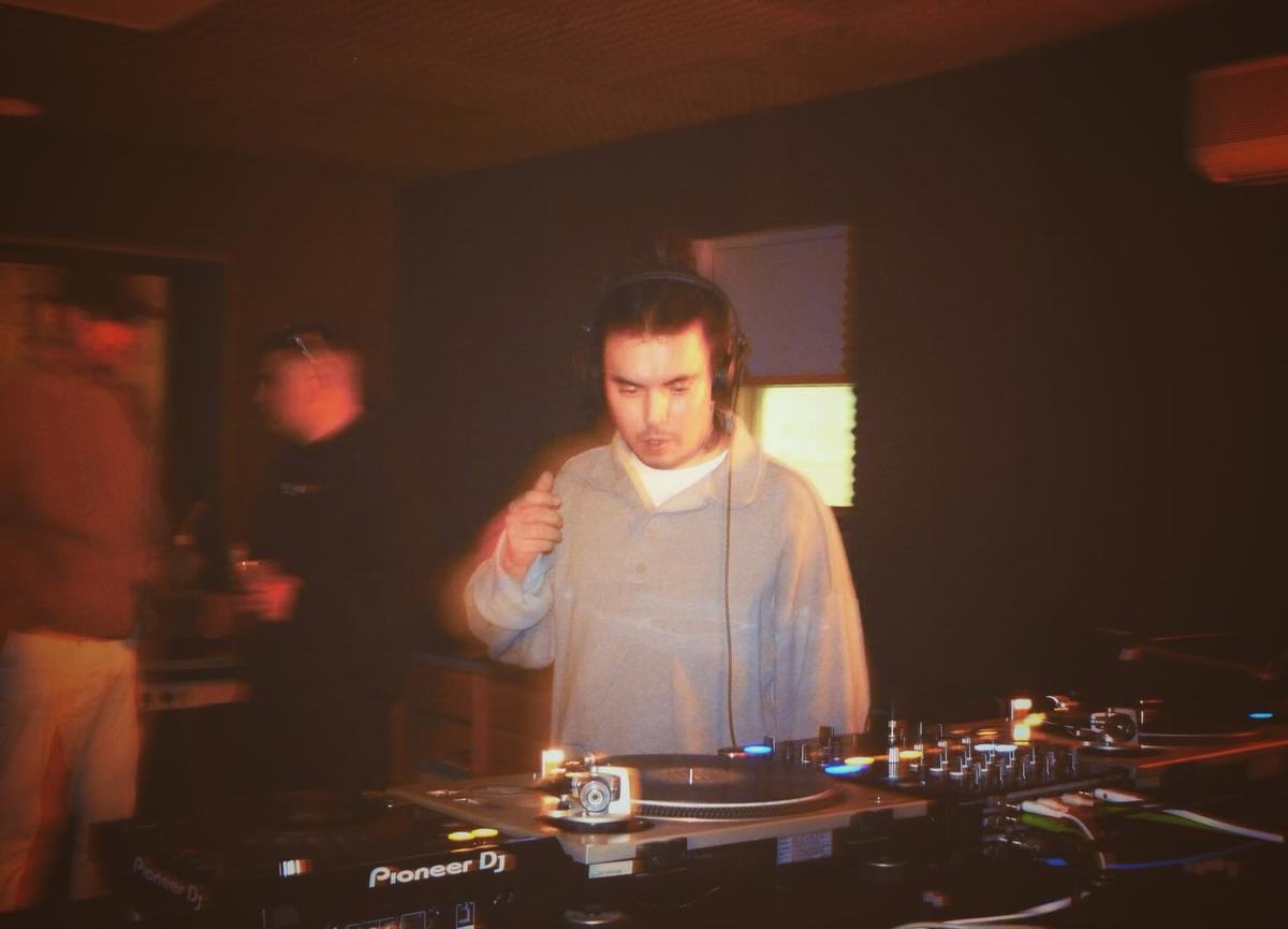 DJ under red light